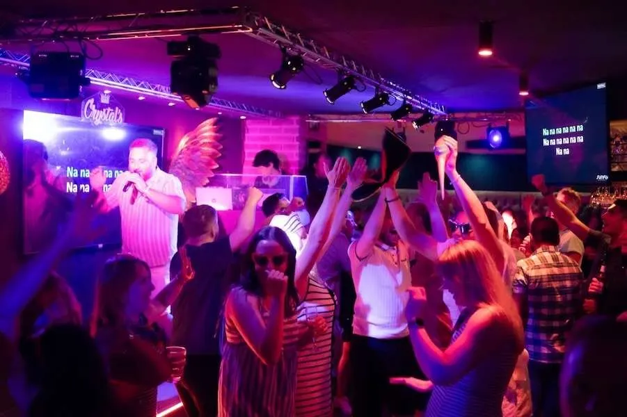 Guests dancing under the lighting rig